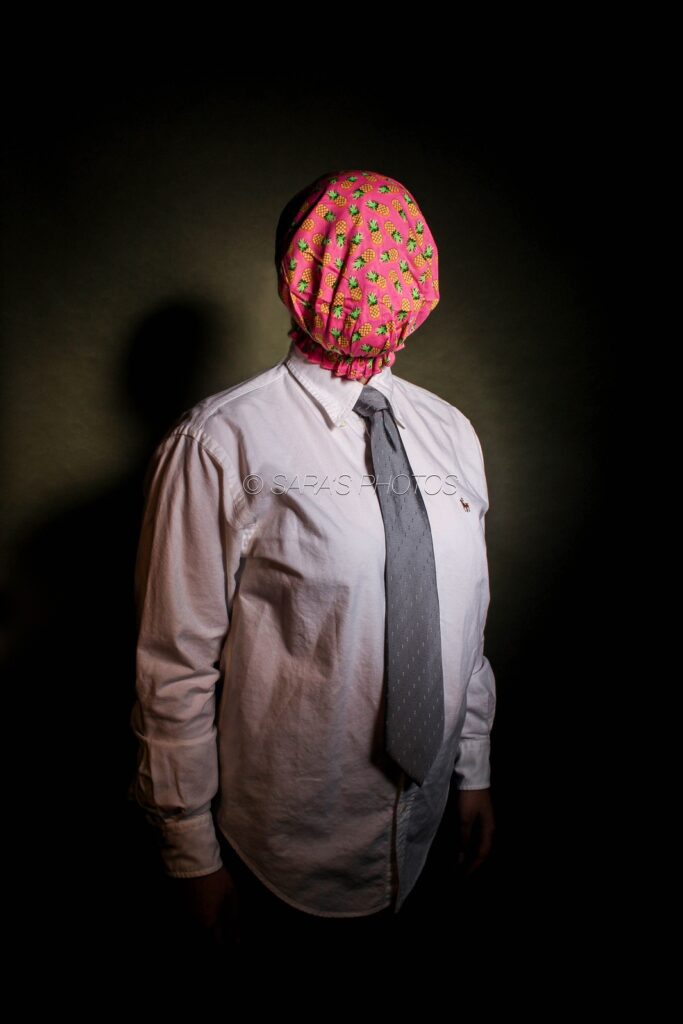 A man with a face covered in a tie.