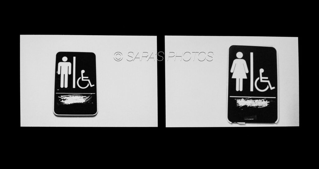 A black and white photo of two different toilets.